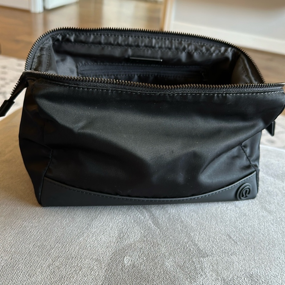 Lululemon toiletry bag. Like new inside but lotion stain on the outside/bottom